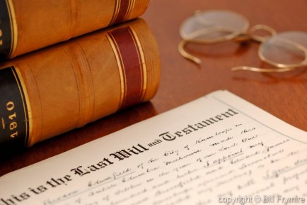 last will and testament shown with glasses and books