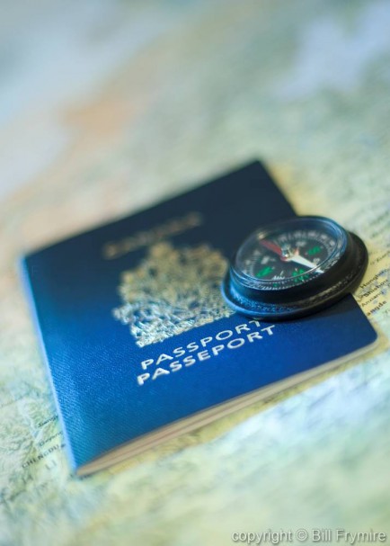 photo of a passport with compass on top representing travel