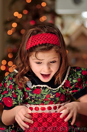 Girl opening Christmas present