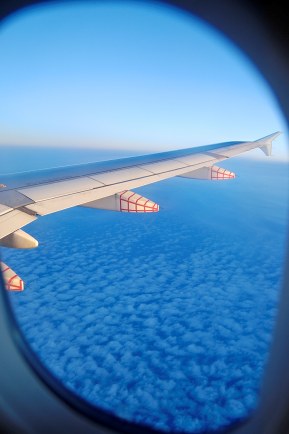 Airplane Wing and Clouds