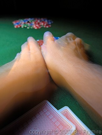 hands pushing poker chips all in