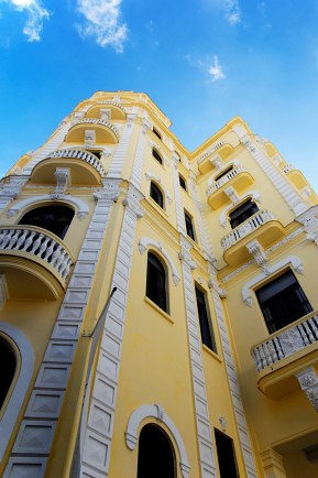 yellow apartment building Cuba