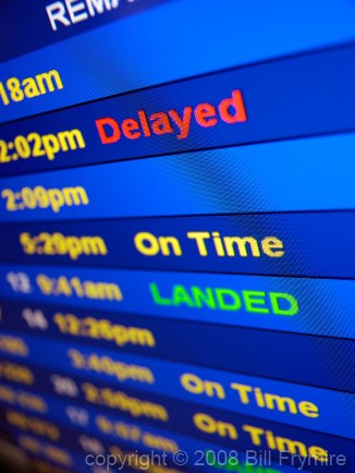 Airport Arrival board display "Delayed" and "Landed"