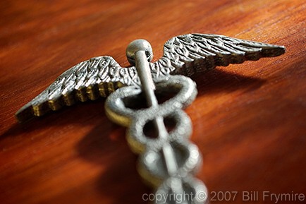 Caduceus - Medical symbol on wood desk