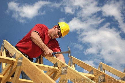 carpenter building house on trusses