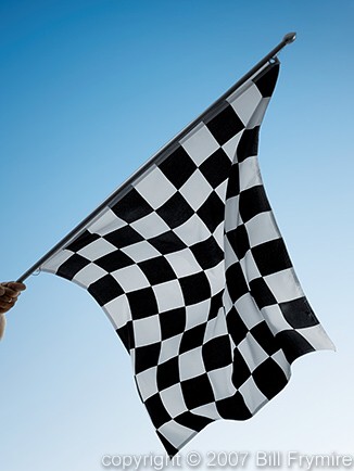 hand waving checkered race flag