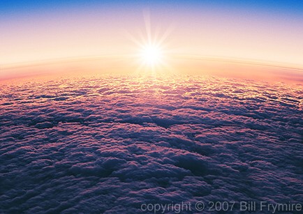 sun in horizon over cloudy sky