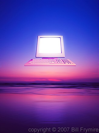 computer over ocean sunrise