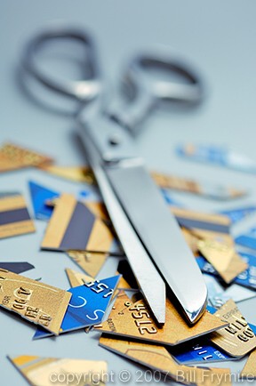 scissors with cut up credit cards