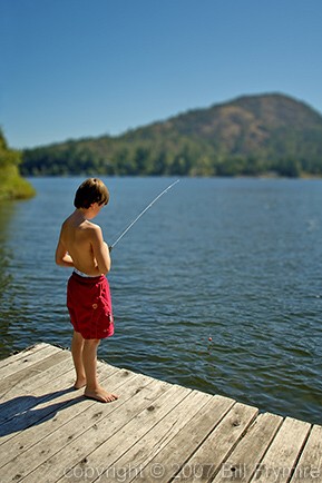 boy fishing off dock