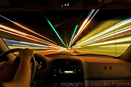 driving vehicle through city traffic at night