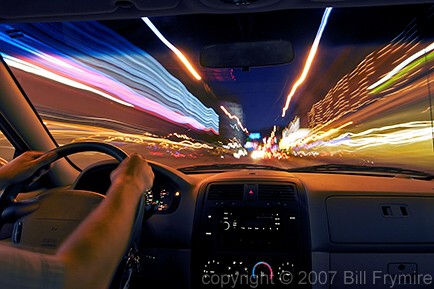 driving vehicle through city traffic at night