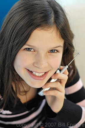 Tween talking on a cell phone