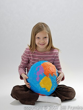 child holding world in lap