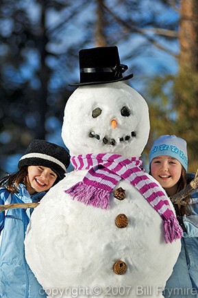 Two girls with snowman