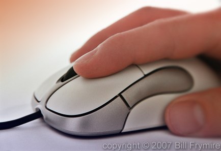 hand on computer mouse