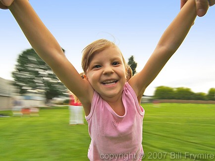 Close up of young girl spinning