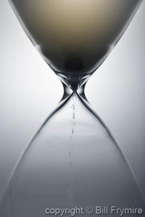 Sand falling through the hourglass