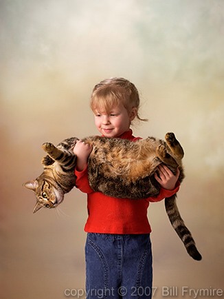 Young girl holding cat