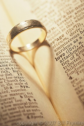 close up wedding ring in dictionary focus love
