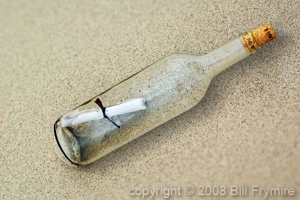 message in a bottle on a beach close-up