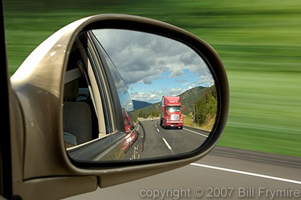 transport truck in side view mirror