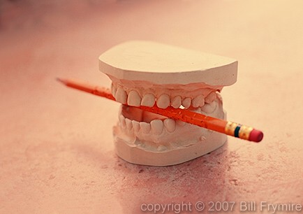 teeth biting pencil