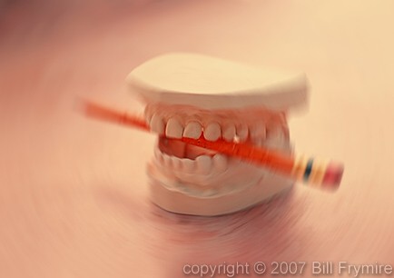 teeth chewing on pencil