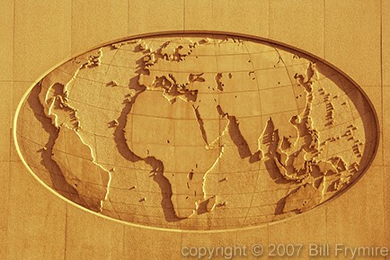 oval world map on side of building