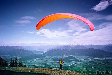 paraglider over valley