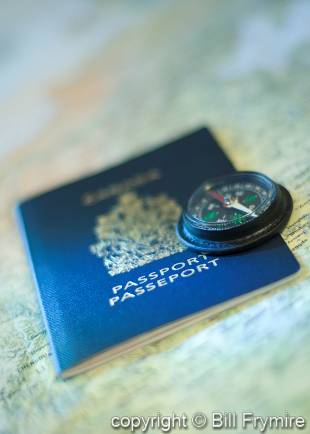 passport with compass on map