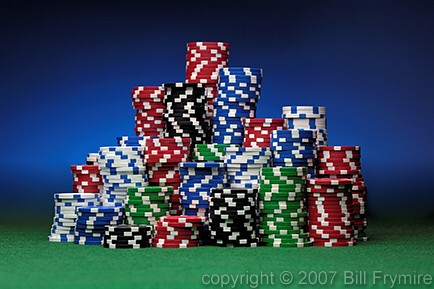 stacks of colored poker chips on green felt