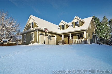 house during winter with fresh snowfall