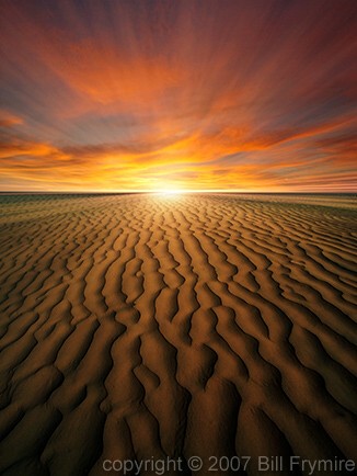 sunset in desert over sand dunes