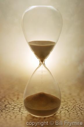 Sands of time through hourglass