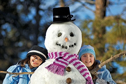 Two girls with snowman