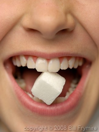 Sugar Cube between Teeth