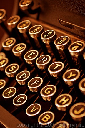 antiquated;antique;Bill Frymire;brown;business;close-up view;communication;glow;keys;letters;manual;numbers;old;old-fashioned;orange;reliable;tried and true;trusted;trusty;typewriter;vertical;