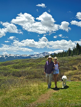 couple hiking with dog