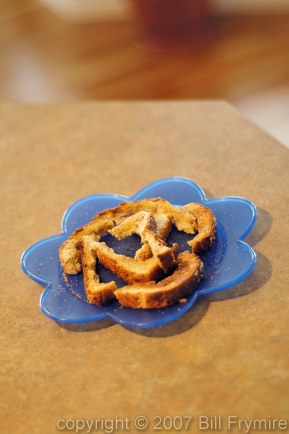 wasted toast crusts on a plastic child's plate