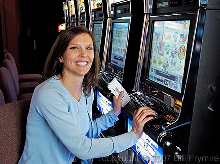 woman playing slot machines