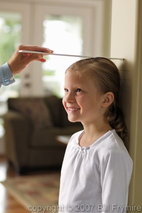 young girl being measured