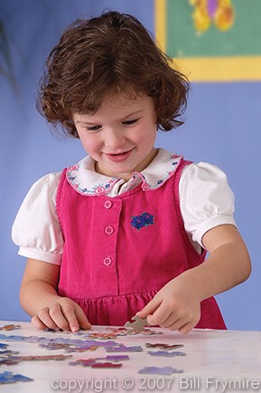 girl doing puzzle