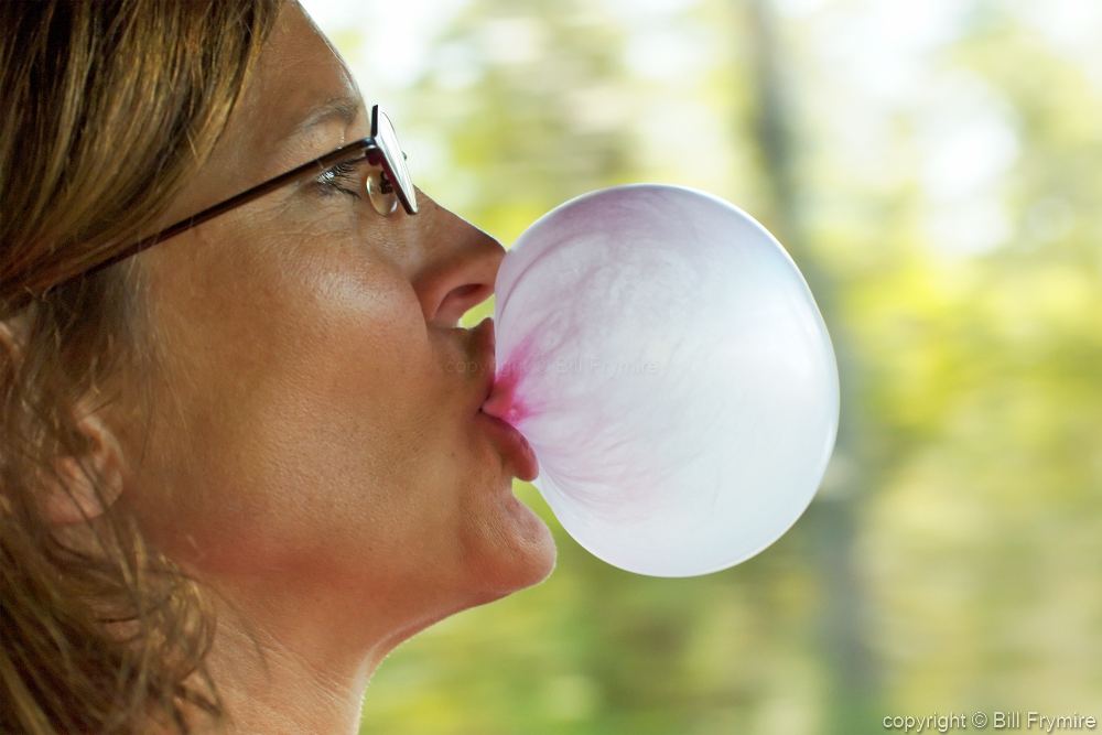 blowing bubble gum bubbles. 