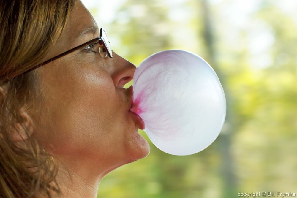 Woman Blowing Bubble Gum