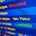 Airport Arrival board display "Delayed" and "Landed"