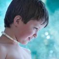 Model released close up of young boy with candy necklace