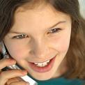 Tween talking on a cell phone