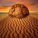 globe buried in sand dune