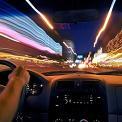 driving vehicle through city traffic at night